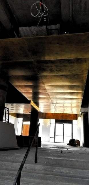 Brass soffit over the entry