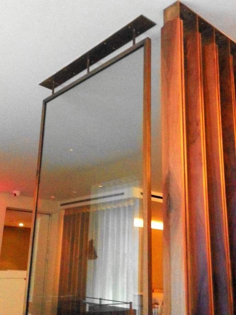 Patinated metal column cladding