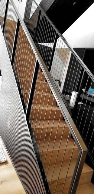 Stair with a vertical rod guard