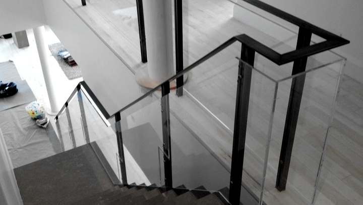 Steel stair with a glass guard