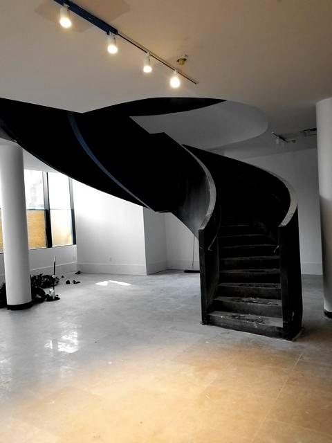 Helical steel stair in a finished room