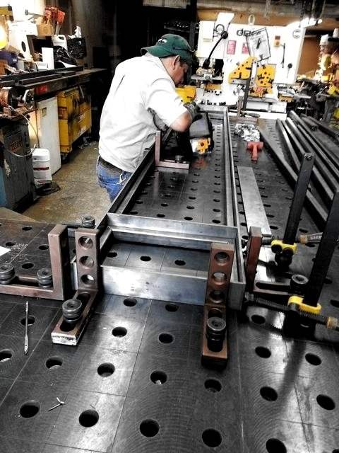 Tacking a frame on the fixture table