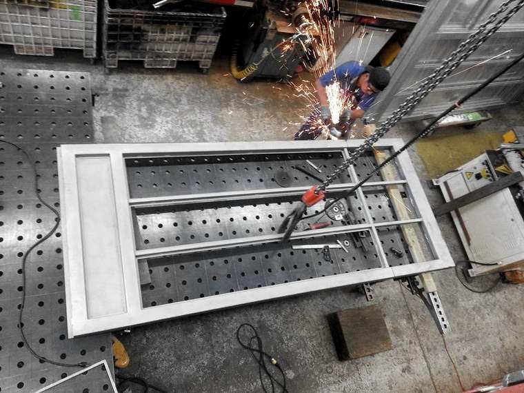 Grinding a steel frame, sparks flying