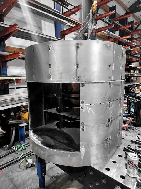 Riveted stainless enclosure in the shop