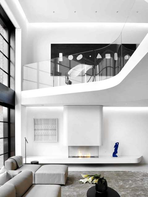 Curved stair guard in a double-height loft