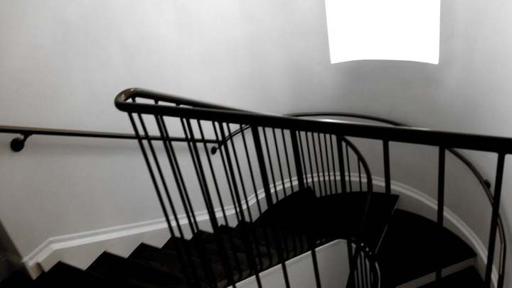 Steel stair rail looking down the flight