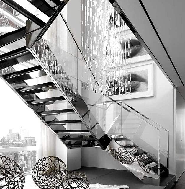 Open steel stair with glass guard